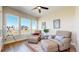 Cozy sitting room features comfortable armchairs, a decorative rug, and large windows offering abundant natural light and scenic views at 220 High Meadows Loop, Elizabeth, CO 80107