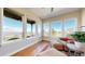 Inviting sitting area with comfortable seating, a telescope to enjoy expansive views, and large windows for natural light at 220 High Meadows Loop, Elizabeth, CO 80107