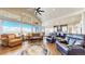Spacious living room featuring hardwood floors, vaulted ceilings, and expansive windows with beautiful views at 220 High Meadows Loop, Elizabeth, CO 80107