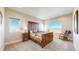 Comfortable main bedroom with natural light, neutral walls, and rustic wood furniture at 220 High Meadows Loop, Elizabeth, CO 80107
