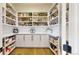 Walk-in pantry offers ample storage space with organized shelving, countertops, and cabinets for efficient kitchen management at 220 High Meadows Loop, Elizabeth, CO 80107