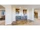 Stylish wet bar area equipped with modern appliances, sleek cabinetry, and tiled backsplash at 220 High Meadows Loop, Elizabeth, CO 80107