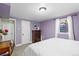 Cozy bedroom featuring lavender walls and a soft carpet at 3083 Ash St, Denver, CO 80207