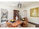 Dining room with an oval wood table set for dinner at 3083 Ash St, Denver, CO 80207