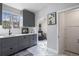 Bright kitchen featuring gray cabinets and white countertops at 3083 Ash St, Denver, CO 80207