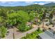 Aerial view of a charming neighborhood nestled among lush green trees at 3384 Avenue F, Kittredge, CO 80457