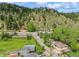 Aerial view showcasing the homes and street of this mountain community at 3384 Avenue F, Kittredge, CO 80457