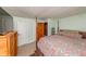 Bright bedroom boasts a four poster bed, mint walls, and natural light at 3384 Avenue F, Kittredge, CO 80457