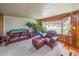 Comfortable living room featuring plush seating and a large window with natural light at 3384 Avenue F, Kittredge, CO 80457