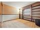 Bedroom featuring neutral carpet and a built-in bookshelf at 15974 E Loyola Dr, Aurora, CO 80013