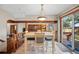 Light filled dining room with sliding glass doors providing access to outdoor space at 15974 E Loyola Dr, Aurora, CO 80013