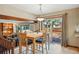 Light filled dining room with a sliding glass door providing access to outdoor deck at 15974 E Loyola Dr, Aurora, CO 80013