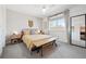 Cozy bedroom features a comfortable bed, ample natural light, and tasteful decor at 9400 E Iliff Ave # 145, Denver, CO 80231