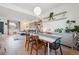 Open dining area with plenty of natural light and an open floor plan to the kitchen and living room at 9400 E Iliff Ave # 145, Denver, CO 80231