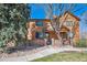 Charming townhouse with wood siding, brick accents, and mature trees in a well-maintained community at 9400 E Iliff Ave # 145, Denver, CO 80231