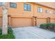 Exterior view of the townhome featuring 2-car garage at 9400 E Iliff Ave # 145, Denver, CO 80231