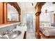 Elegant bathroom featuring a marble-topped vanity and a glass-enclosed shower at 1022 N Pearl St # 202, Denver, CO 80203