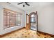 Bright bedroom features parquet floors, a stained glass window, and arched doorway to a balcony at 1022 N Pearl St # 202, Denver, CO 80203
