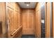 Ornate wood-paneled elevator with detailed carvings and modern operating panel at 1022 N Pearl St # 202, Denver, CO 80203