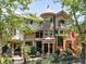 Grand home boasts a stone turret, manicured garden, and stately wrought iron fence at 1022 N Pearl St # 202, Denver, CO 80203