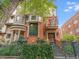 Striking brick building with a balcony, ornate window trim and gated entrance at 1022 N Pearl St # 202, Denver, CO 80203