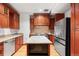 This chef's kitchen features granite countertops, custom wood cabinets, and stainless steel appliances at 1022 N Pearl St # 202, Denver, CO 80203