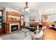 Cozy living room with a fireplace, plush seating, and classic hardwood floors at 1022 N Pearl St # 202, Denver, CO 80203