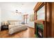Inviting bedroom featuring a fireplace, stained glass windows and parquet floors at 1022 N Pearl St # 202, Denver, CO 80203