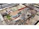 Aerial view of a residential area shows a house with a brown roof and various items cluttered around the properties at 3984 N Cook St, Denver, CO 80205