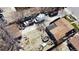 Aerial view of a junky lot with various trucks, sheds, and debris scattered across the premises at 3984 N Cook St, Denver, CO 80205