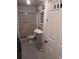 Bathroom featuring white tiles and a shower-tub combination, vanity with sink, and a toilet at 3984 N Cook St, Denver, CO 80205