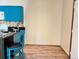 Bright kitchen featuring modern blue cabinets, tiled backsplash, and sleek countertops at 909 S Dawson Way # 19, Aurora, CO 80012