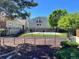 Community pool view of the property, with black iron fence and green surroundings for outdoor enjoyment at 909 S Dawson Way # 19, Aurora, CO 80012