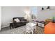 Bright bedroom featuring a cozy seating area, toy storage and a patterned rug on the floor at 4739 Raven Run, Broomfield, CO 80023
