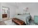 Comfortable bedroom with soft lighting, neutral tones, and an attached bathroom for added convenience at 4739 Raven Run, Broomfield, CO 80023