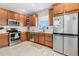 Well-equipped kitchen featuring stainless steel appliances, subway tile backsplash, and ample cabinet space at 4739 Raven Run, Broomfield, CO 80023