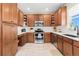 Well-equipped kitchen featuring stainless steel appliances, subway tile backsplash, and ample cabinet space at 4739 Raven Run, Broomfield, CO 80023