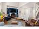 Inviting living room with a cozy fireplace, vaulted ceilings, and a staircase leading to the upper level at 4739 Raven Run, Broomfield, CO 80023