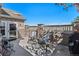 Outdoor patio features stone accents, comfortable seating, and scenic views at 4739 Raven Run, Broomfield, CO 80023