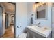Well-lit bathroom featuring modern vanity, updated fixtures, and a clean design at 2201 S Lowell Blvd, Denver, CO 80219