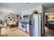 Modern kitchen featuring stainless steel appliances, granite countertops and stylish backsplash at 2201 S Lowell Blvd, Denver, CO 80219