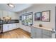 Beautiful kitchen featuring custom cabinets, tile backsplash, modern appliances, and butcher block countertop at 2201 S Lowell Blvd, Denver, CO 80219