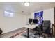 Finished basement office space with neutral walls, carpet, and a desk setup with dual monitors at 2201 S Lowell Blvd, Denver, CO 80219