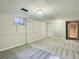 Unfinished basement area with carpet and walkout at 1145 W 101St Ave, Northglenn, CO 80260