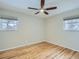 Empty bedroom shows hardwood floors and windows at 1145 W 101St Ave, Northglenn, CO 80260