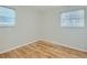 Bedroom featuring hardwood floors, neutral paint, and bright, natural light at 1145 W 101St Ave, Northglenn, CO 80260