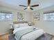 Staged bedroom shows hardwood floors and modern décor at 1145 W 101St Ave, Northglenn, CO 80260