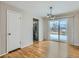 Bright dining room with hardwood floors and sliding glass doors at 1145 W 101St Ave, Northglenn, CO 80260