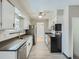 A full kitchen view featuring stainless steel appliances and ample counter space for cooking and entertaining at 1145 W 101St Ave, Northglenn, CO 80260