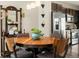 Dining area showcasing a wooden table, chairs, and view of stainless steel appliances at 10788 Ventura St, Commerce City, CO 80022